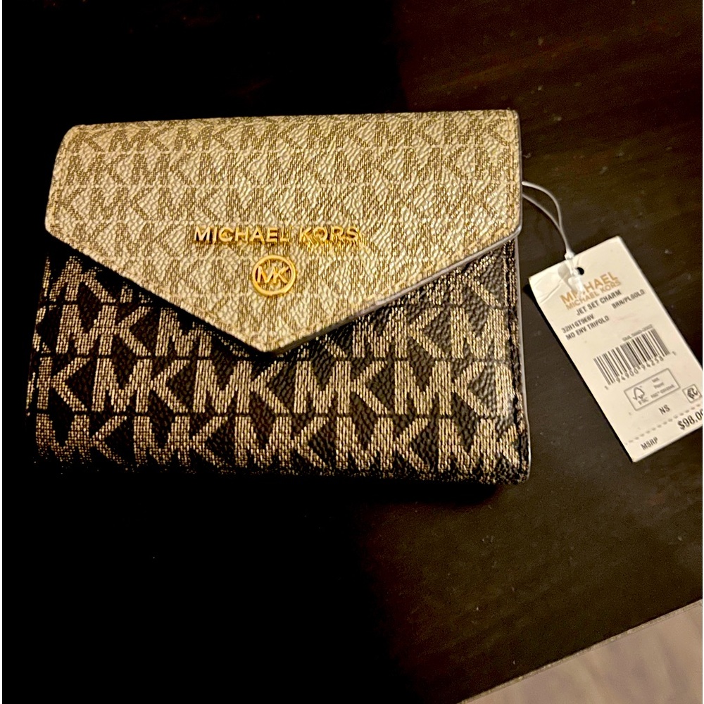 Michael Kors wallet. Brand new with tags. Deep brown with gold embellishments.